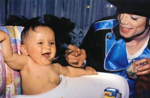 MJ-feeding the happu baby.jpg